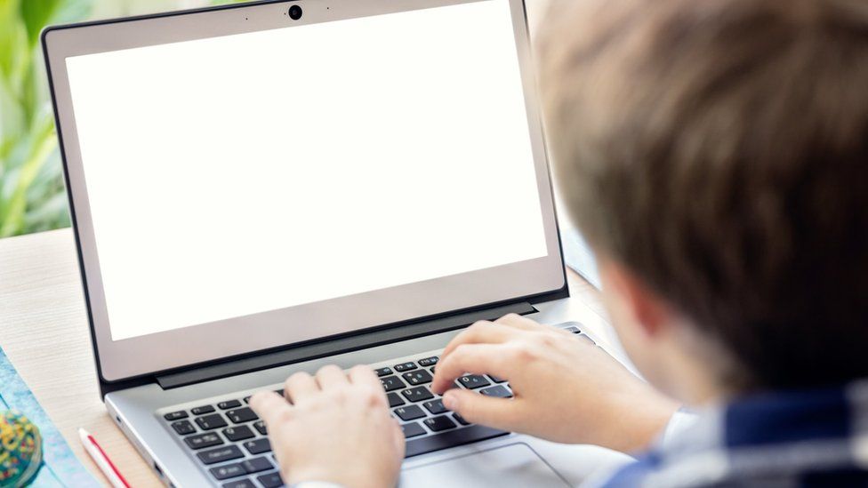 Boy-on-the-internet-with-laptop-computer