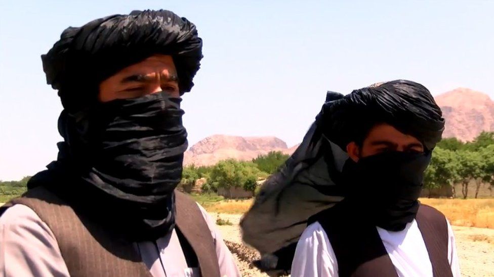 Two member of Afghan Taliban talk to BBC's Auliya Atrafi