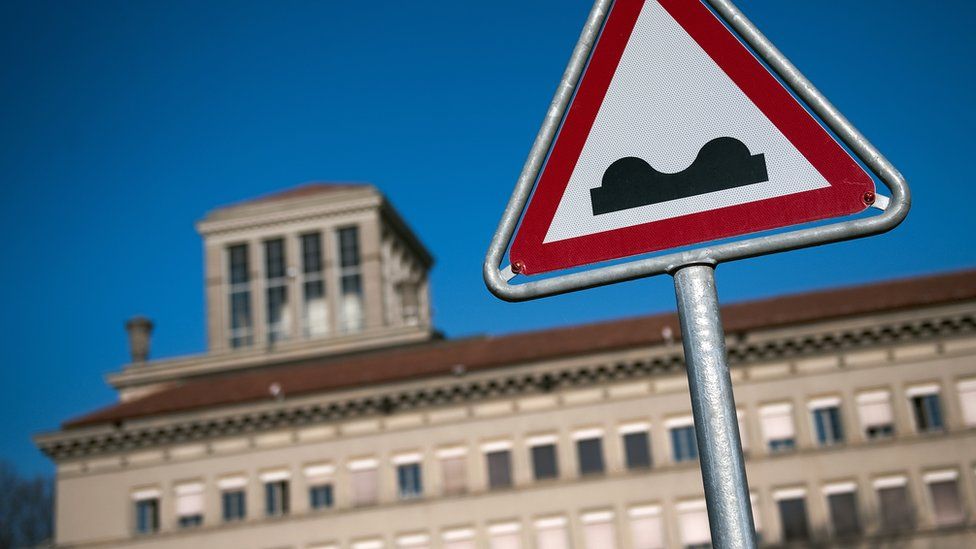 A road sign in front of the World Trade Organization (WTO) headquarters in Geneva