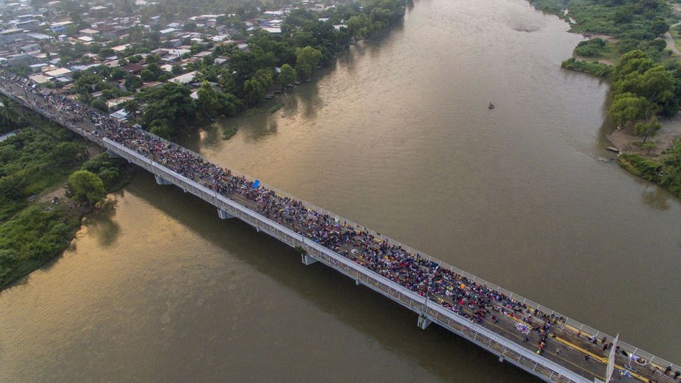 The migrant caravan crosses from Guatemala into Mexico, in October 2018