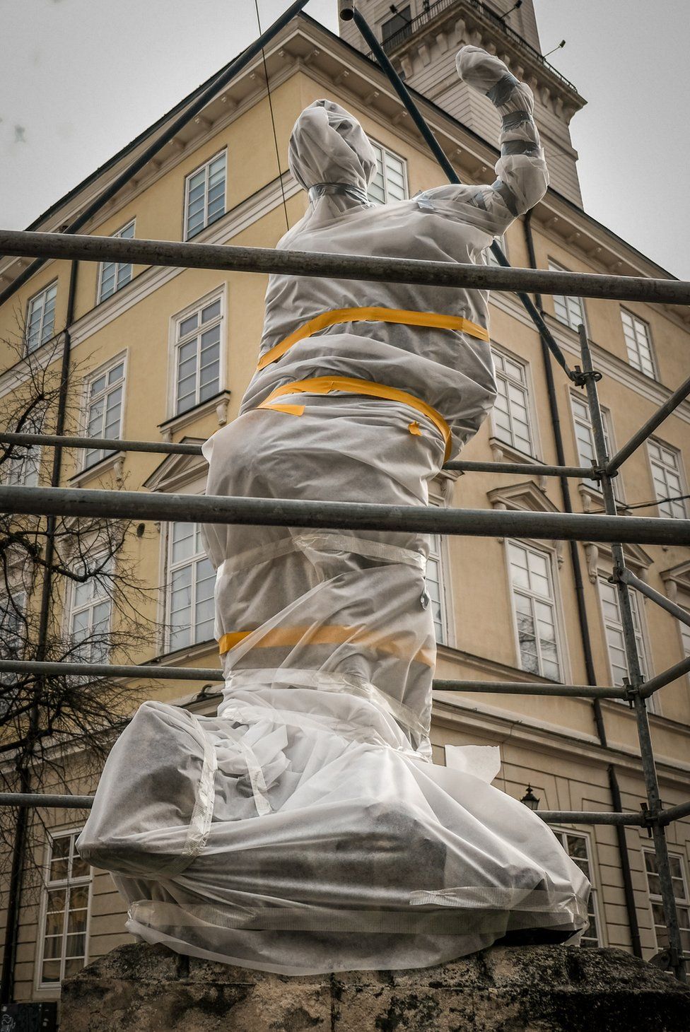 Greek gods and goddesses on fountains in Lviv's town square have been wrapped and scaffolded