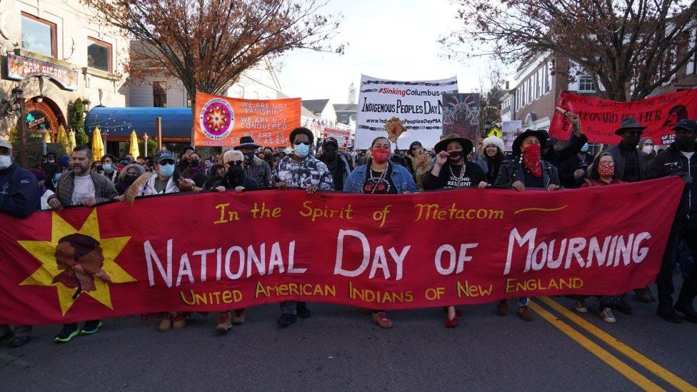 People march during the National Day of Mourning, on Thanksgiving day, November 25, 2021 in Plymouth, Massachusetts. -