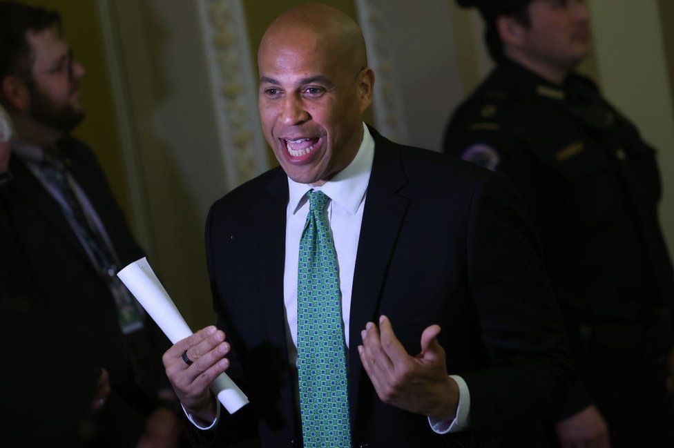 Senator Cory Booker gesticulates while holding a piece of paper at the US Capitol on 2 March, 2023