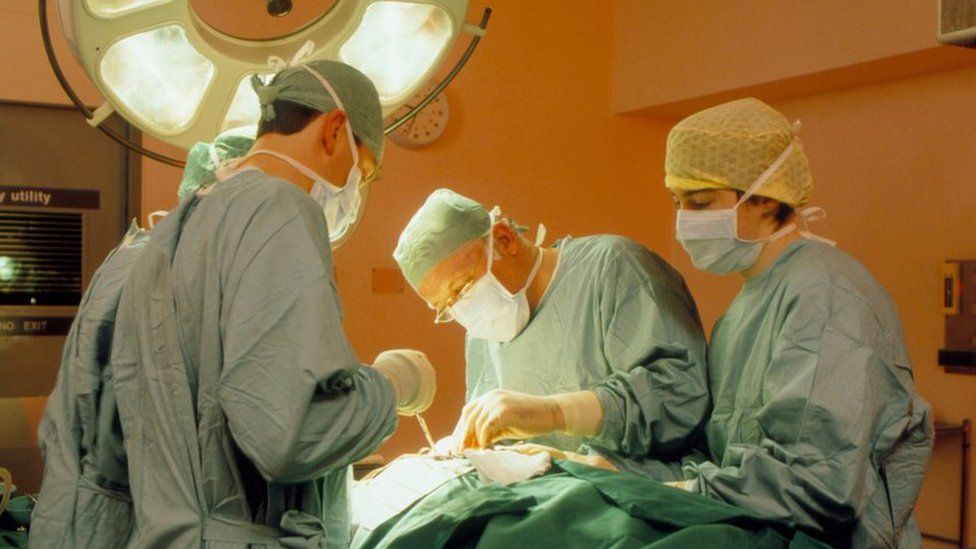 Surgeon and assistants at work during an operation