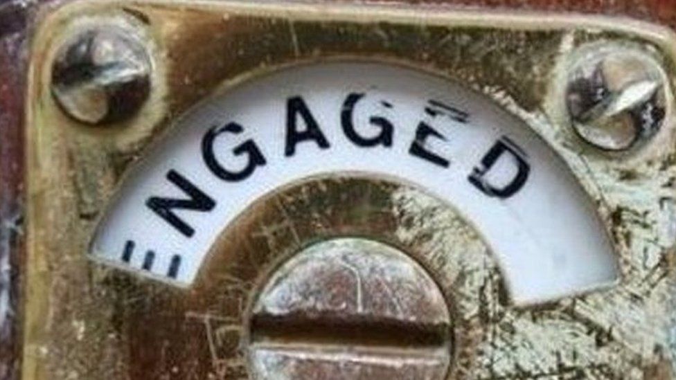 Engaged toilet sign