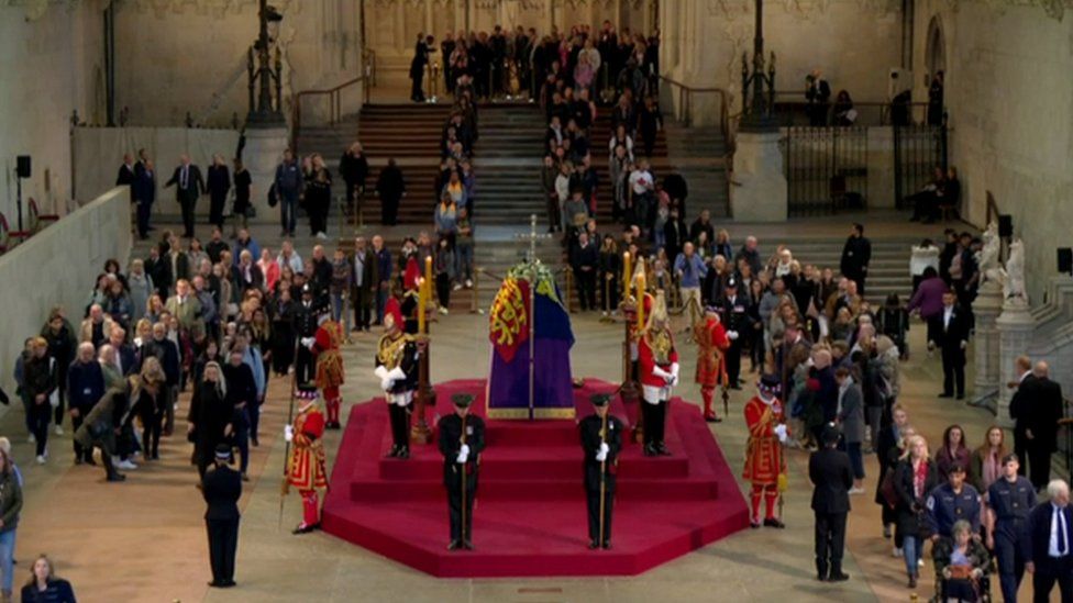 Members of the public file past the Queen's coffin