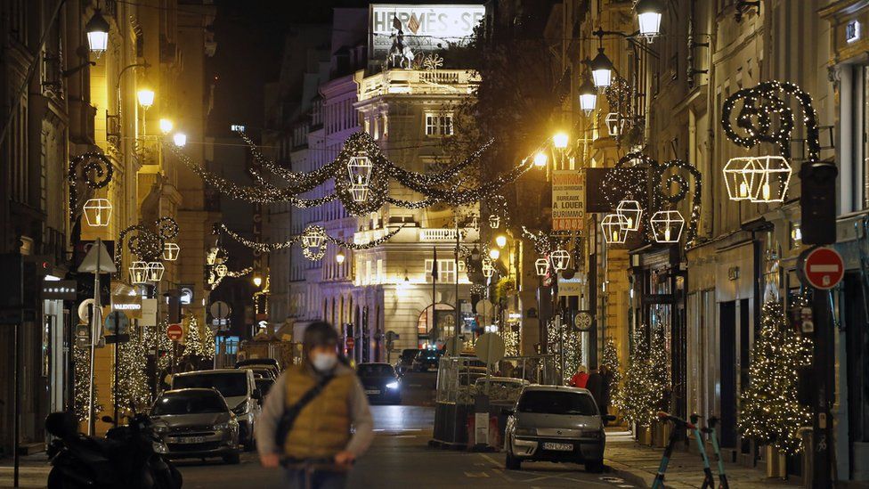 Rue Saint-Honore is decorated with illuminations for Christmas and New Year celebrations on November 22, 2020 in Paris