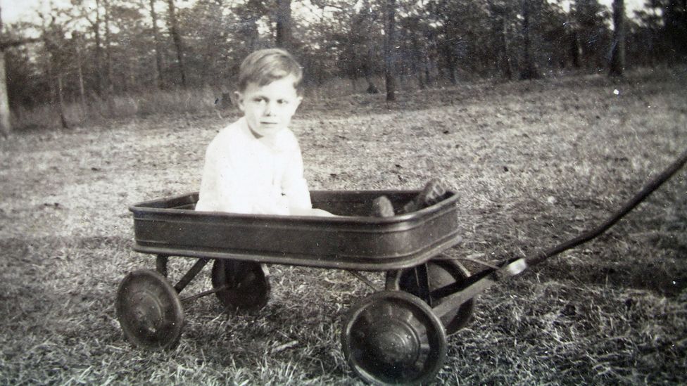 Donald Grey Triplett in a field, as a boy