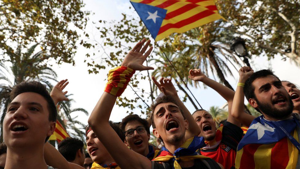 Protesters shout slogans and wave Esteladas (Catalan separatist flags) as they gather outside the High Court of Justice of Catalonia in Barcelona, Spain, 21 September 2017