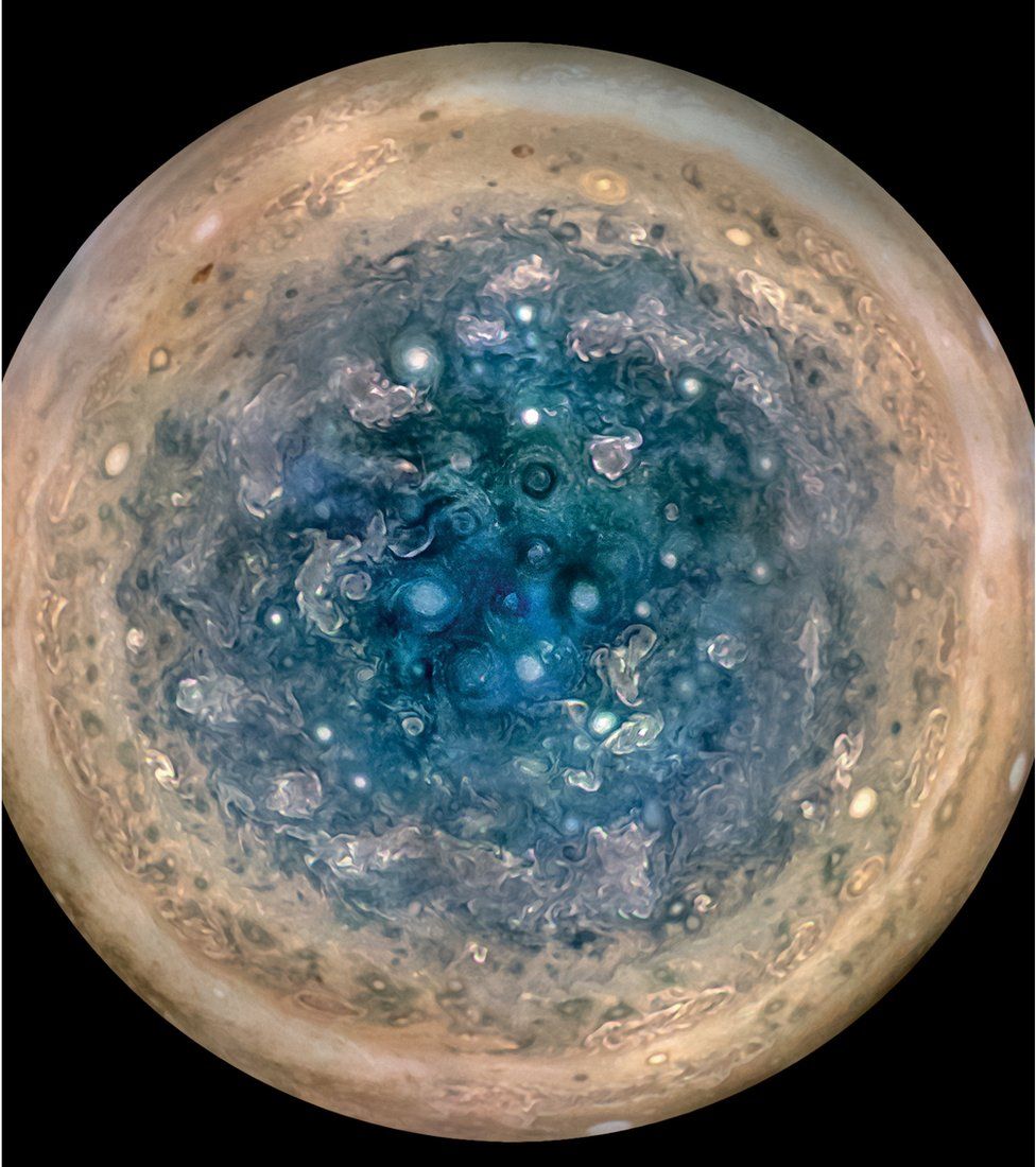 South Pole: The polar cloud structure at Jupiter is very different from that at Saturn