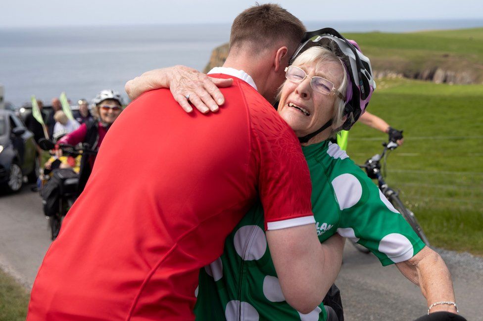 granny mave gets a hug at the finish
