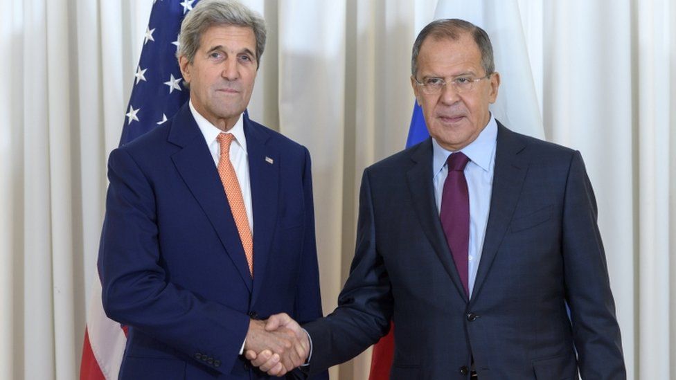 US Secretary of State John Kerry, left, and Russian Foreign Minister Sergei Lavrov shake hands