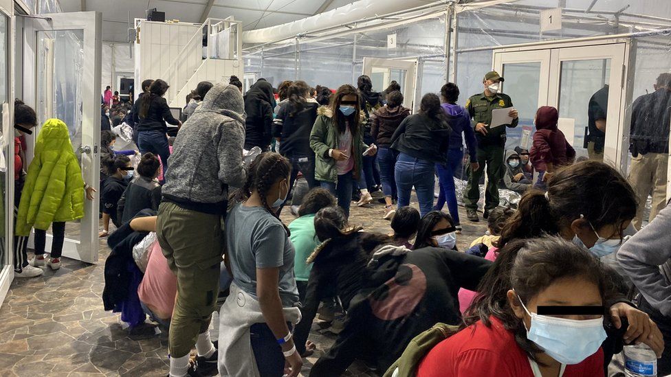 Migrants at the US Customs and Border Protection temporary processing centre in the city of Donna