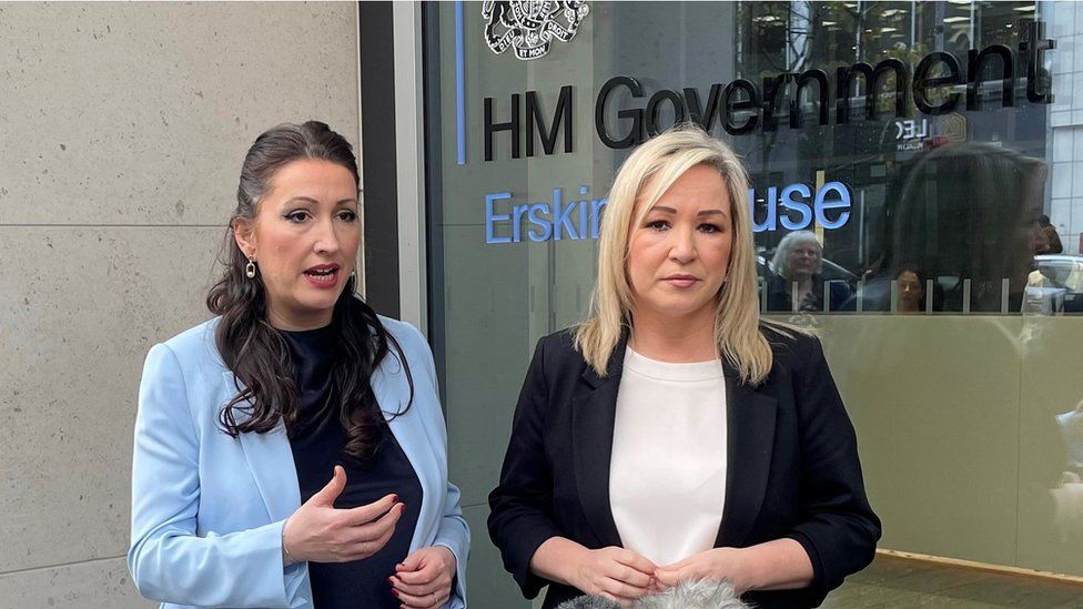 Deputy First Minister Emma Little-Pengelly and First Minister Michelle O'Neill standing outside the NIO