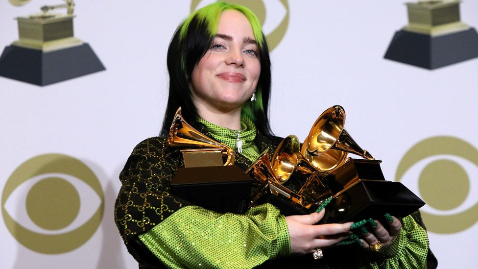 Billie Eilish with her haul of Grammy Awards