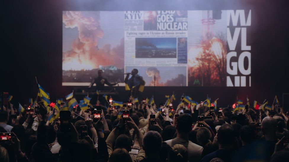 A crowd watches Tvorchi perform at a club in Lviv