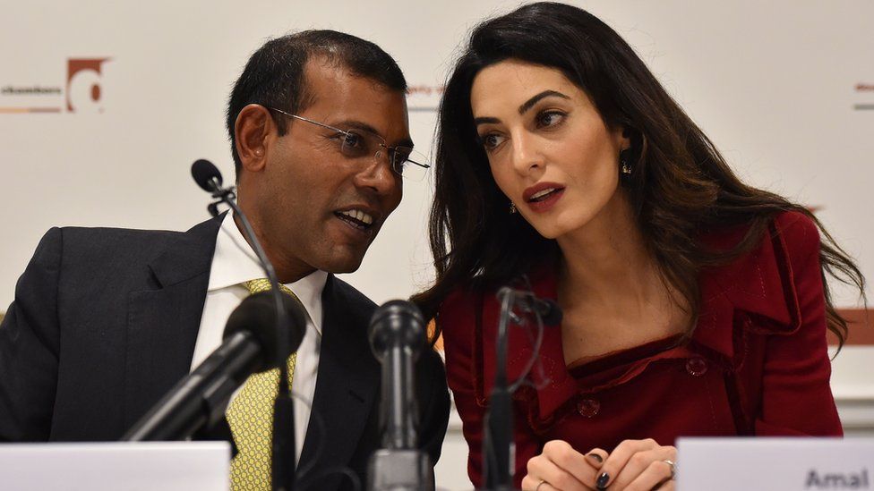 British lawyer Amal Clooney (R) listens as former Maldives president Mohamed Nasheed speaks during a press conference in London, on January 25, 2016