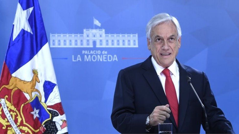 Handout picture released by the Chilean Presidency showing Chilean President Sebastian Pinera speaking to the nation in Santiago, on October 22, 2019,