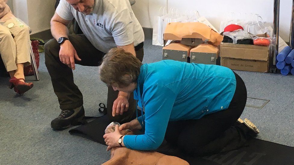 Dog owners learning how to perform CPR