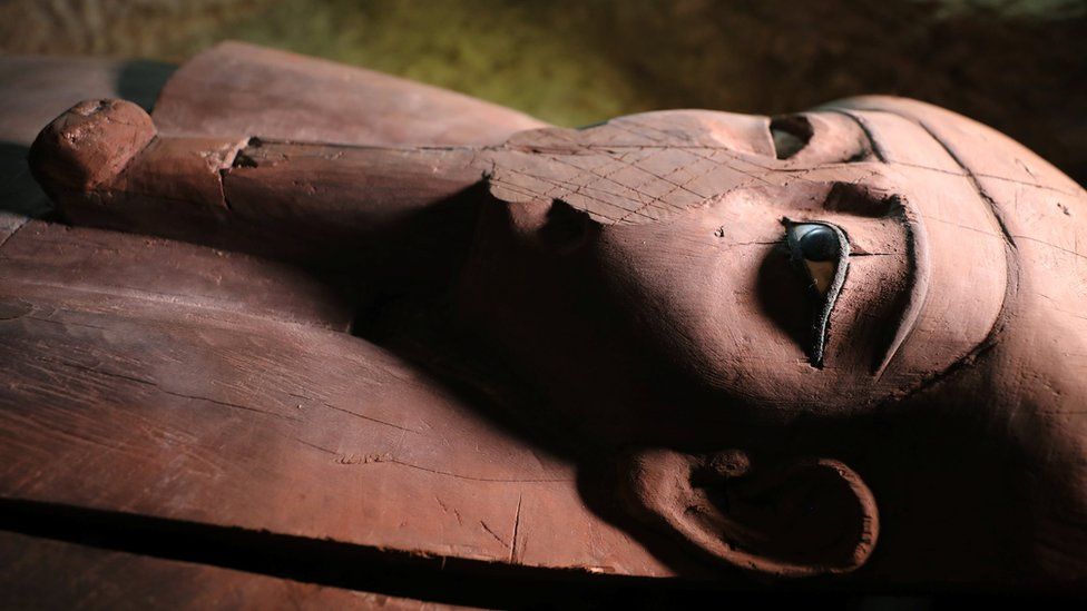 A wooden coffin inside the recently discovered burial site in Minya, Egypt
