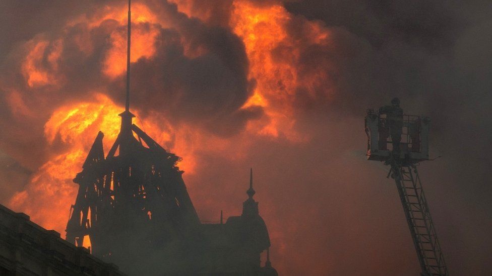 Fire-fighters work to douse the flames at the Portuguese Language Museum in Sao Paulo, Brazil, Monday, Dec. 21, 2015.