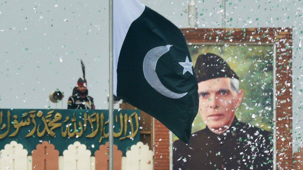The portrait of Muhammad Ali Jinnah is seen at at the India-Pakistan Wagah border post during a ceremony to celebrate Pakistan's Independence Day on 14 August 2017