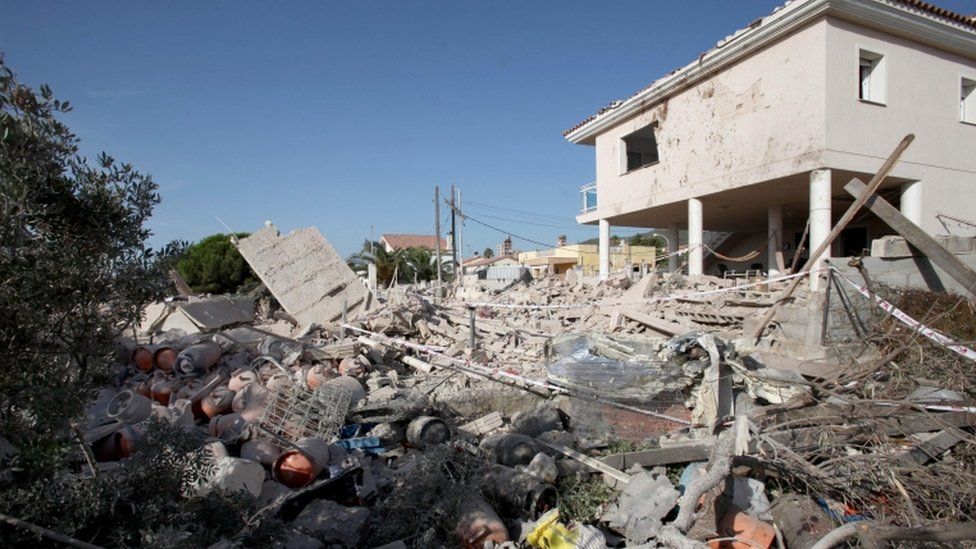 Image shows destroyed remains of a house, thought to be a bomb-making centre for the group.