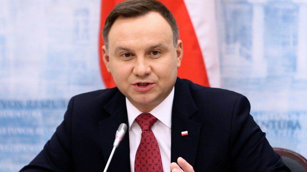 Poland's President Andrzej Duda gestures as he gives a press conference on 17 February