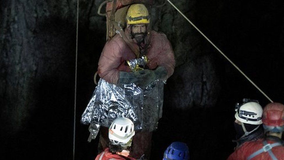 Mr Dickey is carried out of the Morca cave on a stretcher as his rescue operation comes to a successful end