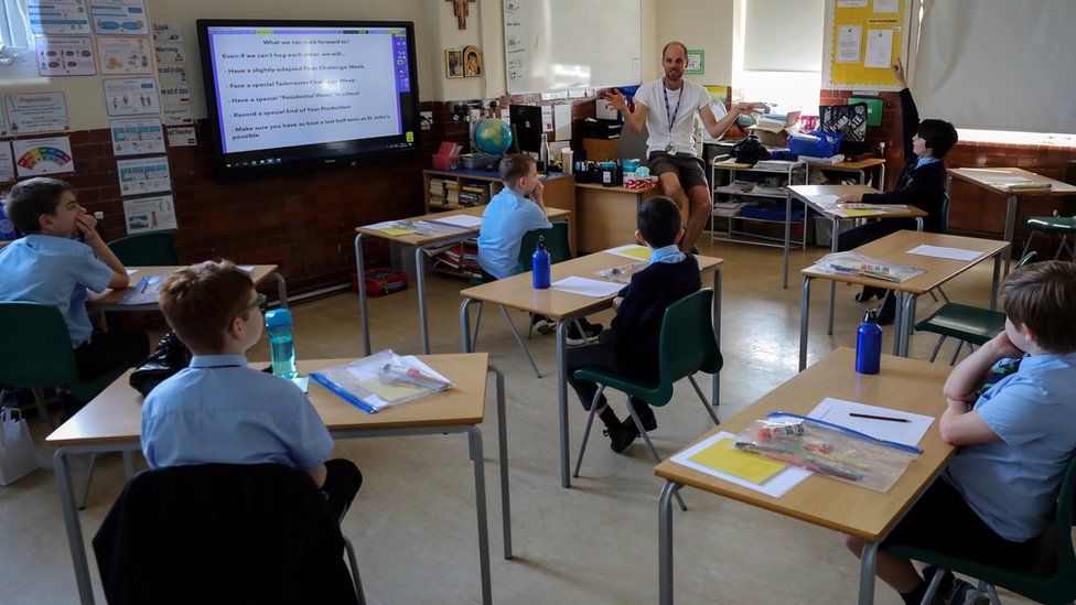 Pupils sit two metres apart in a classroom