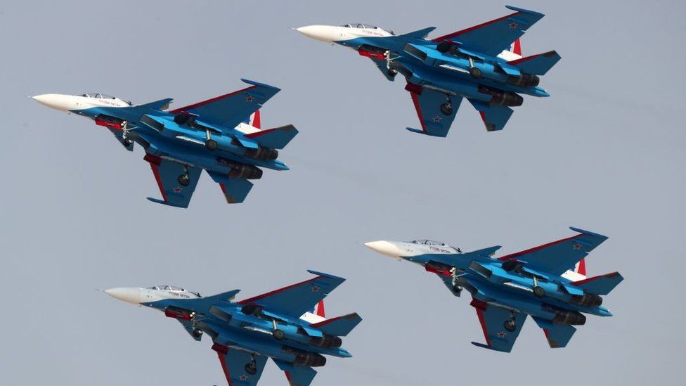 Four Sukhoi Su-30SM from the Russian Knights aerobatic team perform during the Dubai Airshow on November 12, 2017, in the United Arab Emirates.