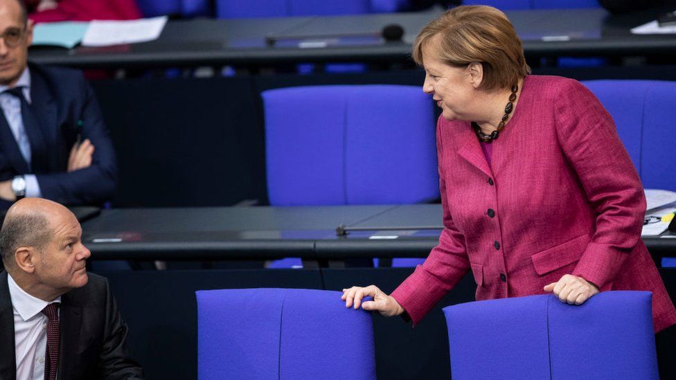 German Chancellor Angela Merkel talks to German Finance Minister and Vice Chancellor Olaf Scholz in October 2020