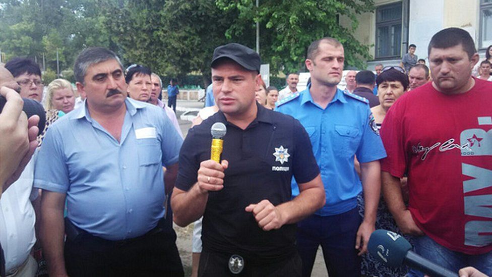 Ukrainian police with villagers (pic: Odessa police website)