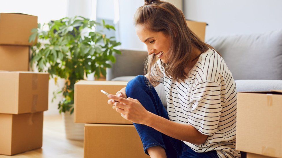 Young woman moving house