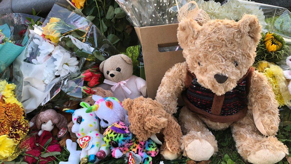 Teddies and flowers laid in tribute