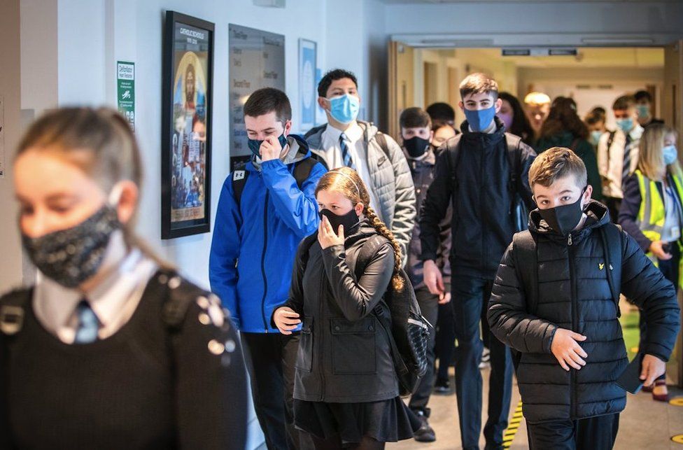 Students at St Columba"s High School, Gourock, wear protective face masks as they head to lessons as the requirement for secondary school pupils to wear face coverings when moving around school comes into effect across Scotland