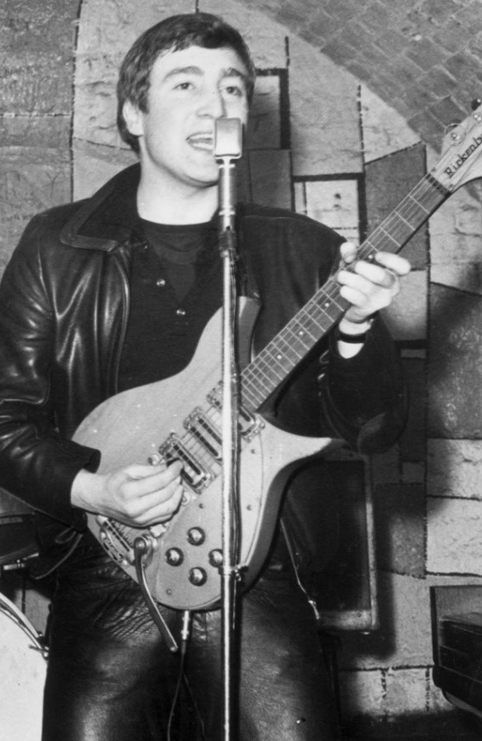 December 1961: Singer, guitarist and songwriter John Lennon (1940 - 1980) of the British group The Beatles live on stage at the Cavern Club in Mathew Street, Liverpool.