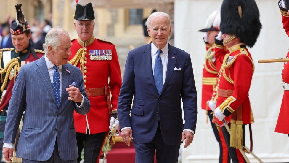King Charles and US President Joe Biden inspect the Guard of Honour at Windsor Castle