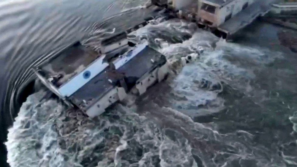 Water gushes through damaged dam