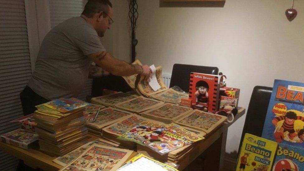Paul Cooper with a small selection of his Beano comics and memorabilia
