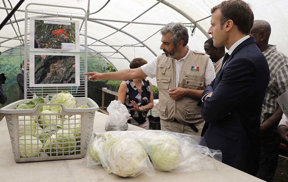 French President Emmanuel Macron attends a tour of a farm centred around ground pollution from the banned pesticide chlordecone on the French Caribbean island of Martinique, on September 27, 2018
