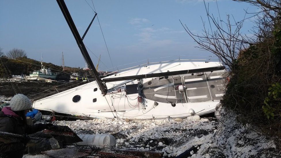 A destroyed boat at the marina