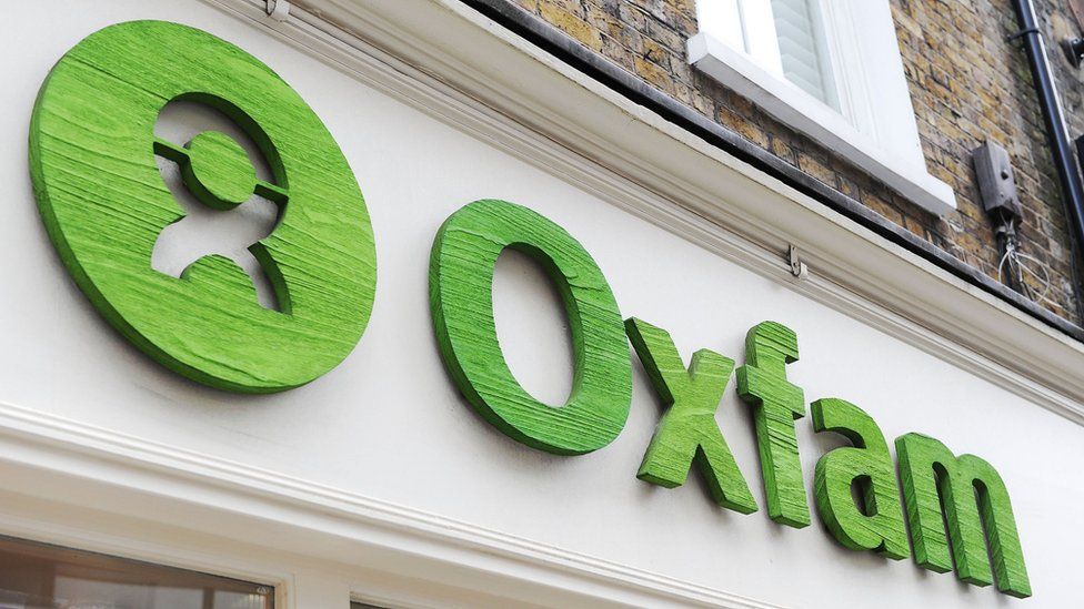 An Oxfam sign above one of its shops