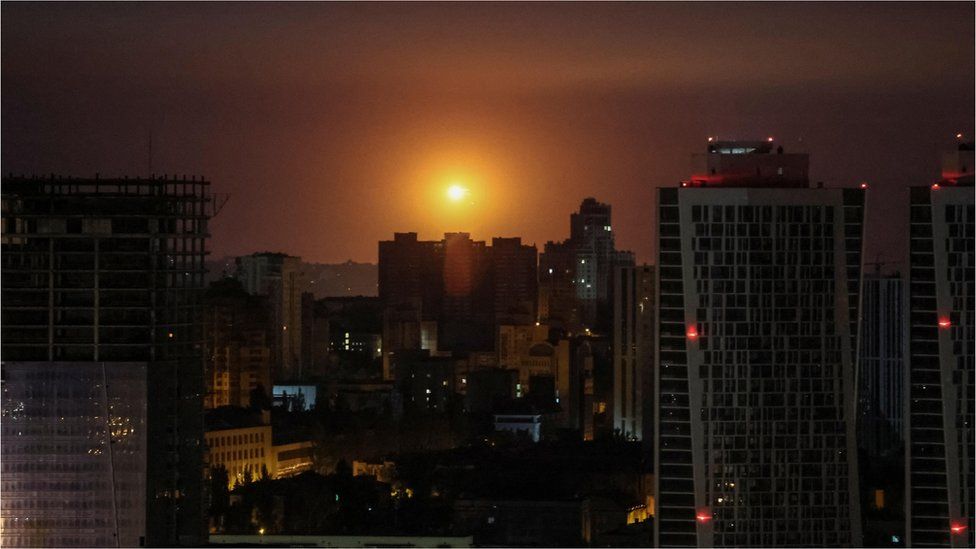 An explosion in the sky over Kyiv during a Russian drone and missile strike