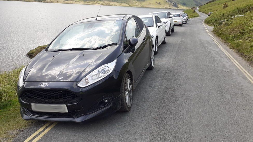 Cars parked on double yellow lines in the Lake District