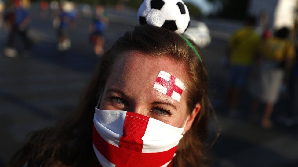 An England supporter poses for a phot in Rome