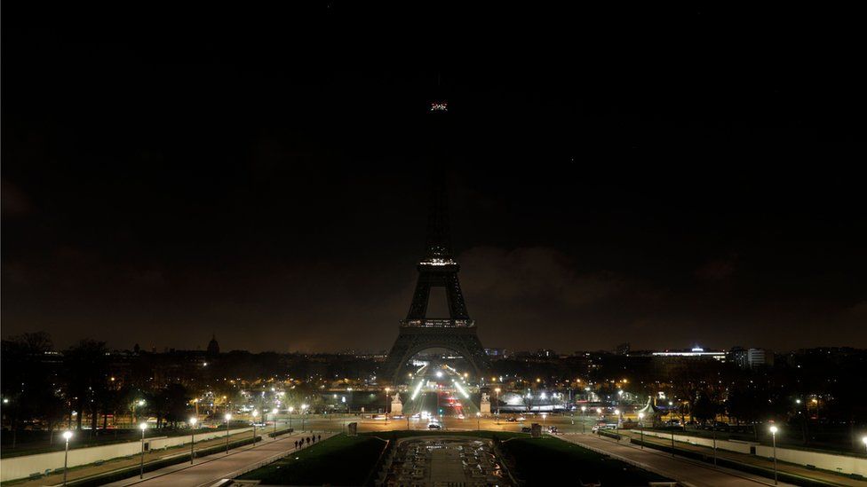 The Eiffel Tower goes dark in memory of the victims of the attack on Christmas shoppers at a market in Strasbourg, France, 13 December 2018