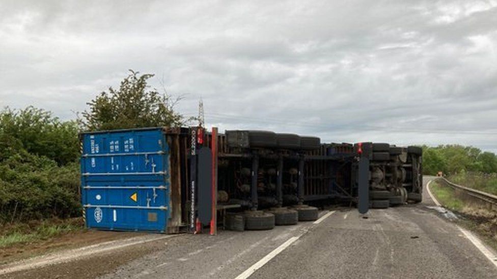 The overturned lorry on the northbound carriageway at Water Newton, Cambridgeshire