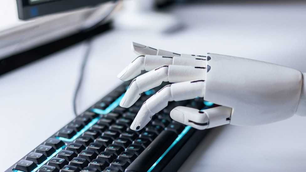 A stock image of a robots hands on the keyboard as a metaphor for invention