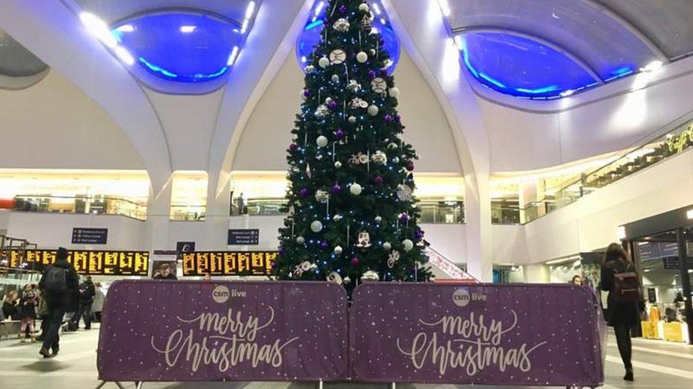 A Christmas tree within Birmingham New Street station